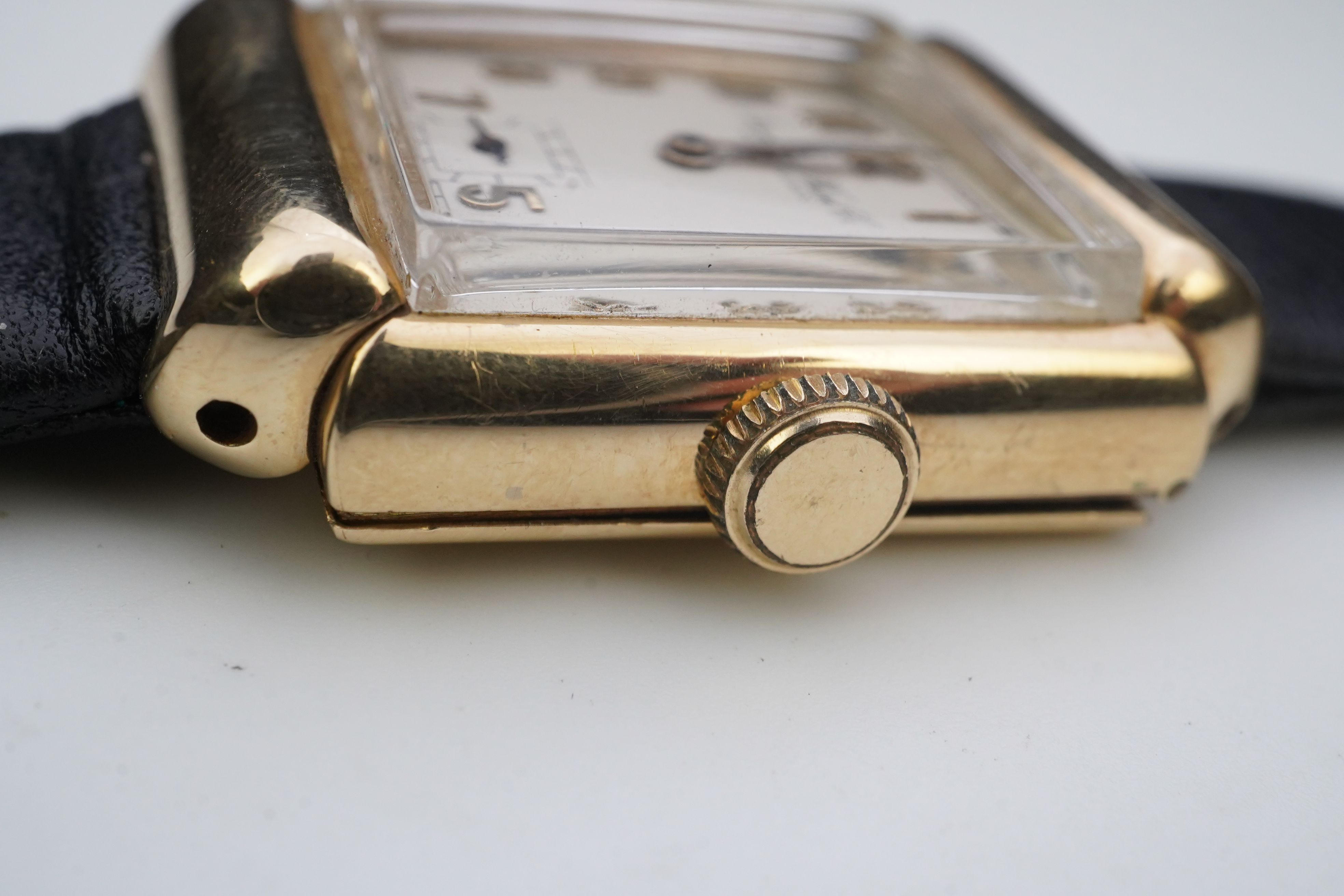 A gentleman's mid 20th century 14k gold International Watch Company manual wind wrist watch, on a later associated leather strap